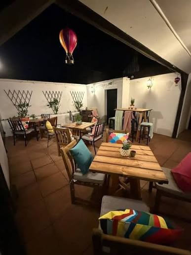 Warm timber pub interior with inviting tables